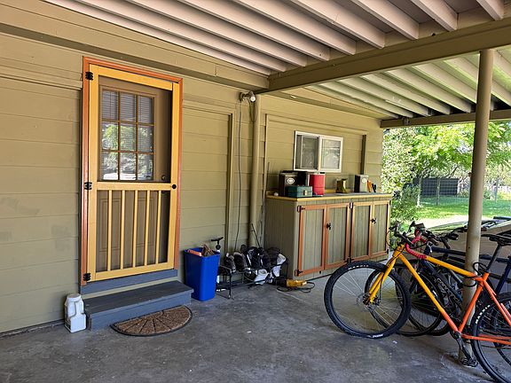 Private entrance. Storage cabinets. One parking space under the carport.
