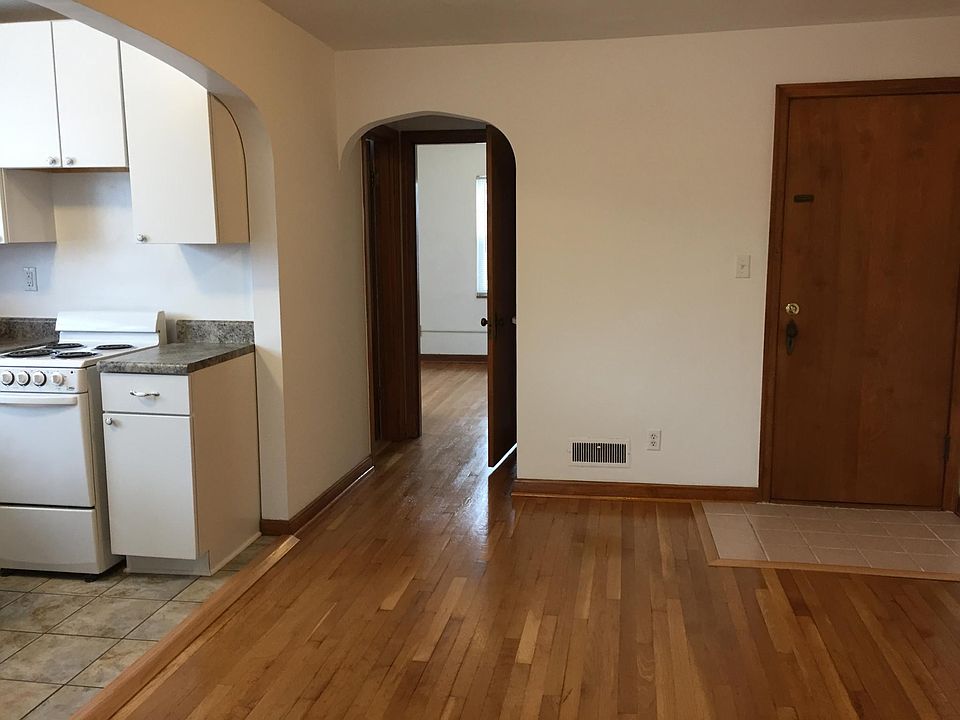 Dining area and short hallway leading to bathroom and bedroom Rear hallway door is on the right.