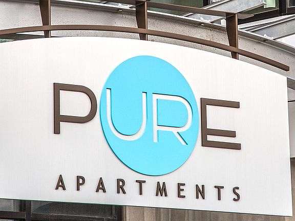 Sign reading Pure Apartments.