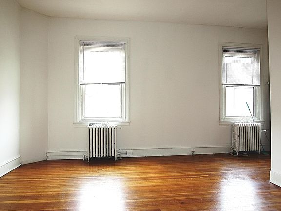 Living Room (Unfurnished) with 2 windows overlooking Pine Street