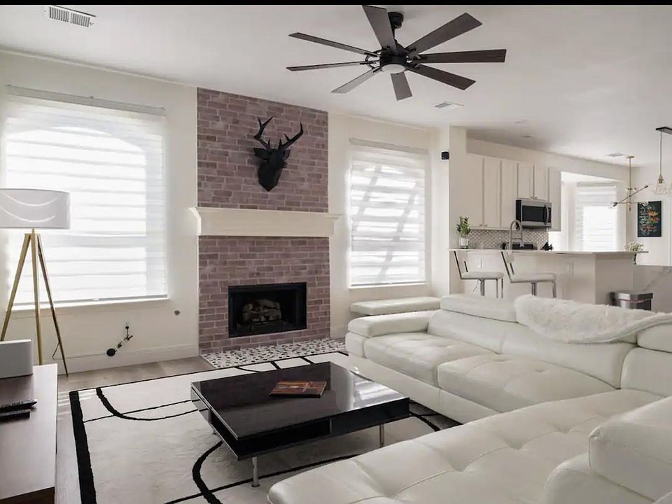 Living room with new gas burning fire place, modern couch, center table and pretty much everything upgraded.