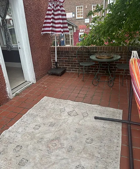 Terrace Level with Grill Overlooking the Backdrop of the Home