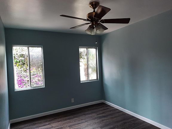 Custom Paint Color, New Floor, Ceiling Fan in Bedroom.