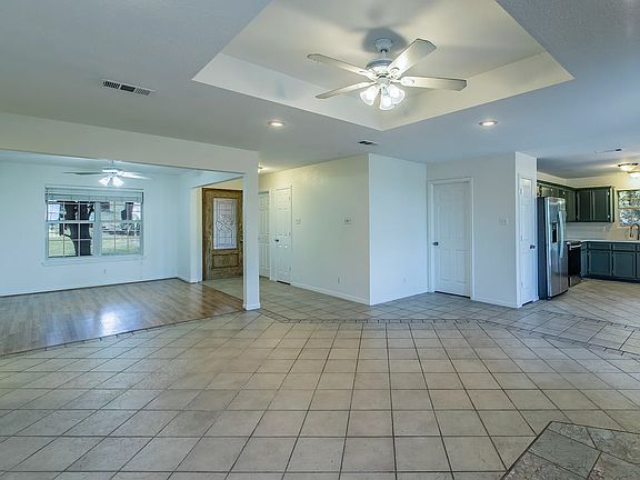 View of Formal Dining/Library and Kitchen from Main Living Room