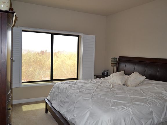 Master bedroom with large window to enjoy the mountain views
