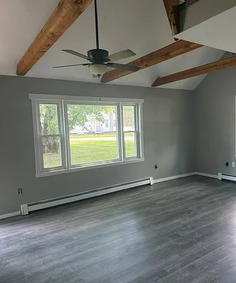 Living room with exposed beams.