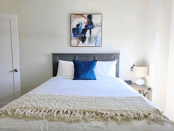 Bedroom 2 (queen bed, single bed, ceiling fan, AC, TV)