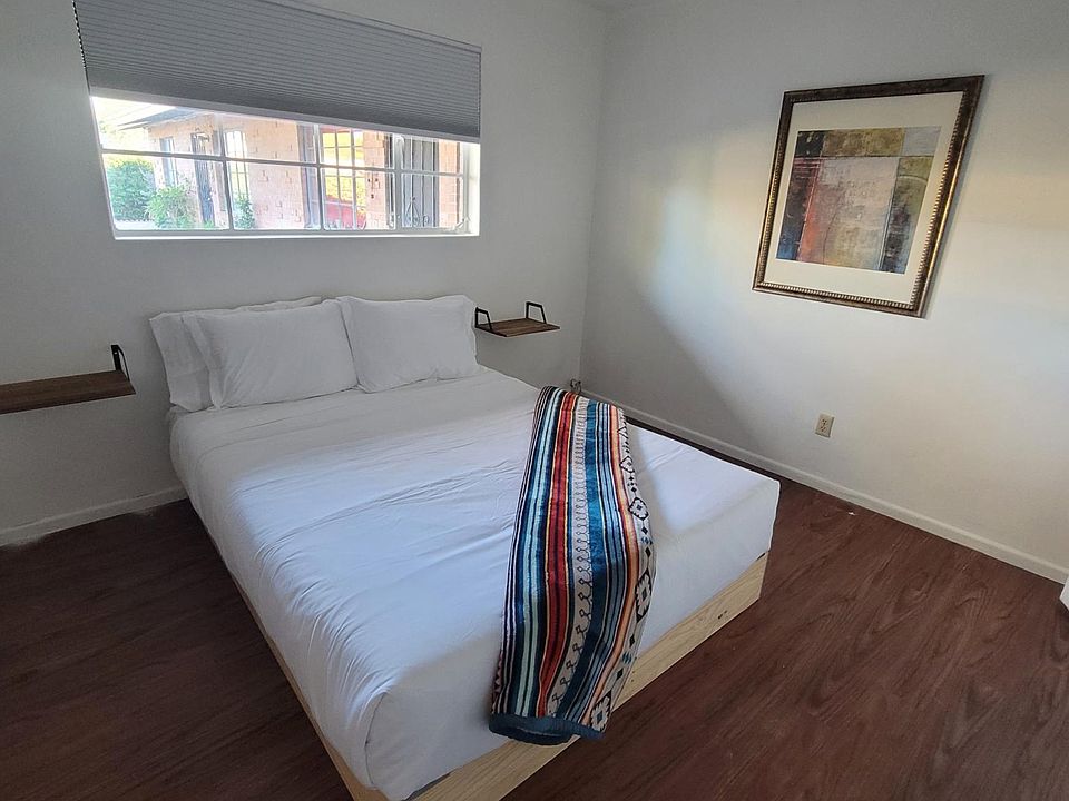 Bedroom shown with queen bed