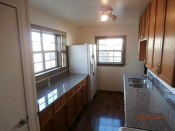  Kitchen with granite counter tops, under mount sink and refrigerator stays.