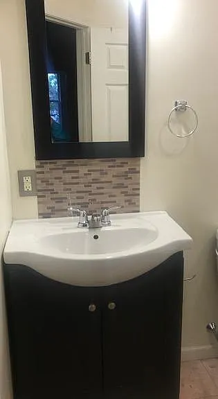 Bathroom, all tile with bathtub and shower
