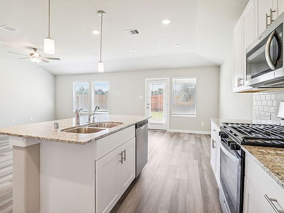 Kitchen of 1610 King Ranch Road at Stewarts Ranch, a Meritage Homes community in Richmond, Texas.