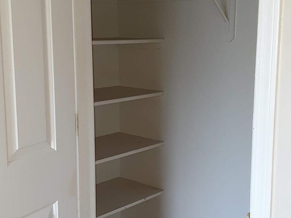 Closet has storage on either side