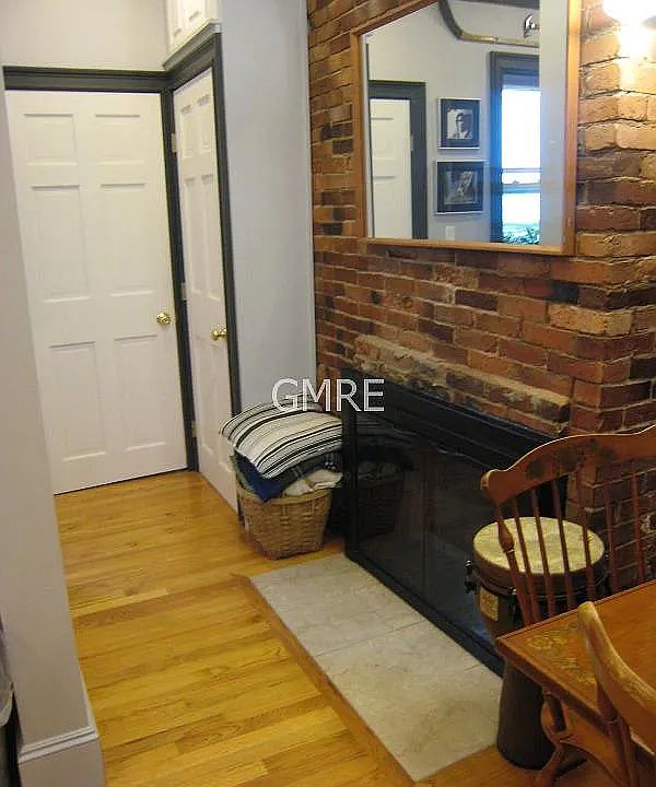 This is the fireplace area that leads to a closet on the right, the bedroom is straight and the bathroom is to the left.