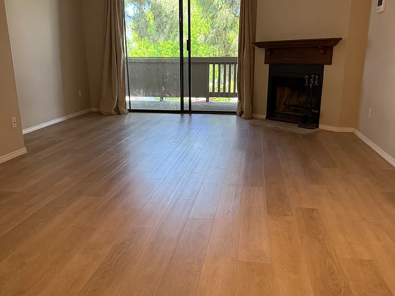 Great room with space for family living and dining, open to natural light and ocean breeze.