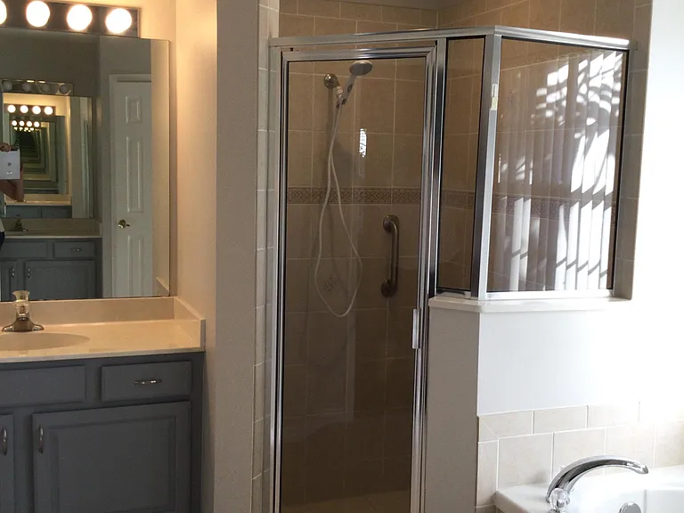 Large open airy master bath, Shower, separate bath and toilet locker