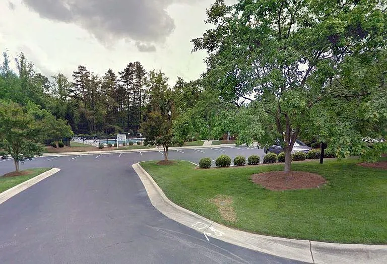 This photo shows the parking lot for the community pool, which is located just about one block from the home.