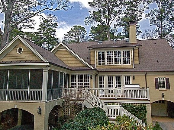 Complete with screened porch, deck, blue stone patio