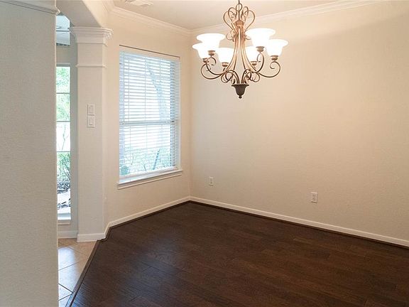 The dining room with beautiful wood floor is just to the left of the front foyer.