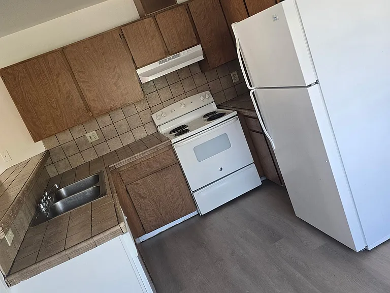 Kitchen with stove and refrigerator included