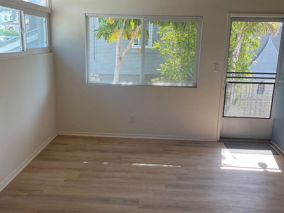 View of the living room with ceiling fan.