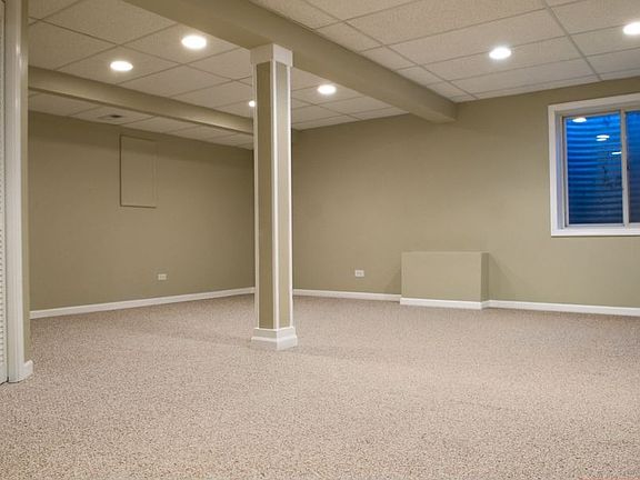 Finished basement, drop ceiling, recess lighting, enclosed laundry.