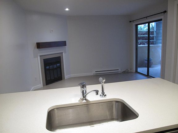 Wood-burning fireplace and sliding door to patio