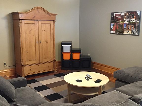 Living Room: comes with couch and Entertainment Center (TV included)