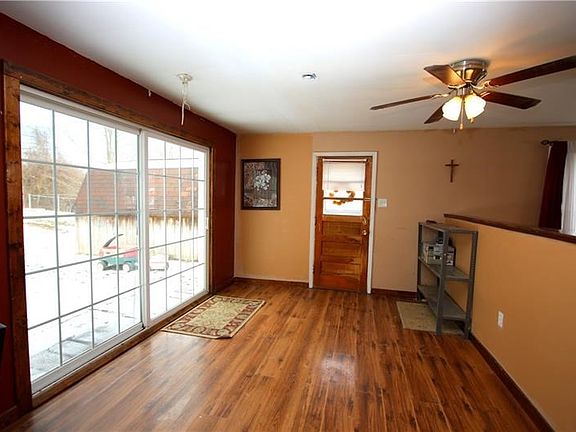 PLENTY of Natural Light Flowing thru-out offering a comfortable amount of Privacy!.... View of 13x11 Dining Room w/ Oversized Sl