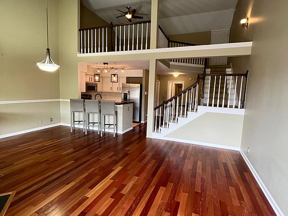 Living Room- view of kitchen and loft