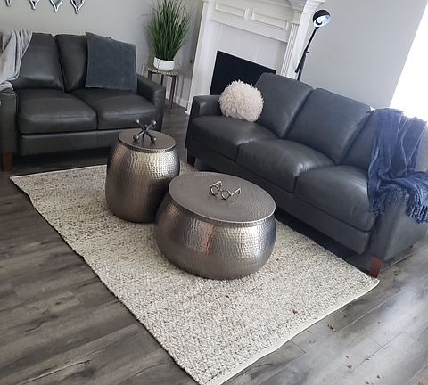 Enjoy a large living area with a fireplace and ceiling fan.