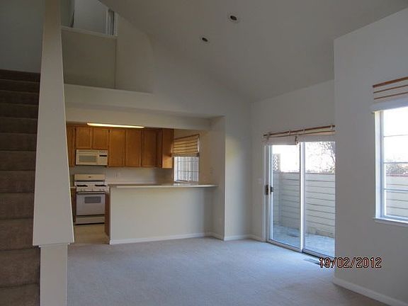 Bright Sunny Living Room with Door to Patio