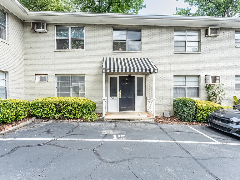 Exterior entrance. Parking spot 15 is assigned to the unit plus additional off street parking (first come first served) in back.