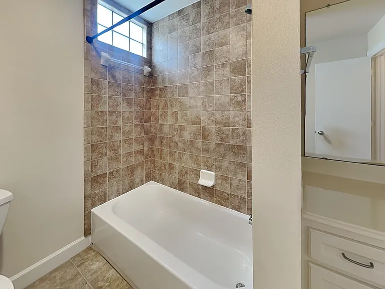 This bathroom features beige t