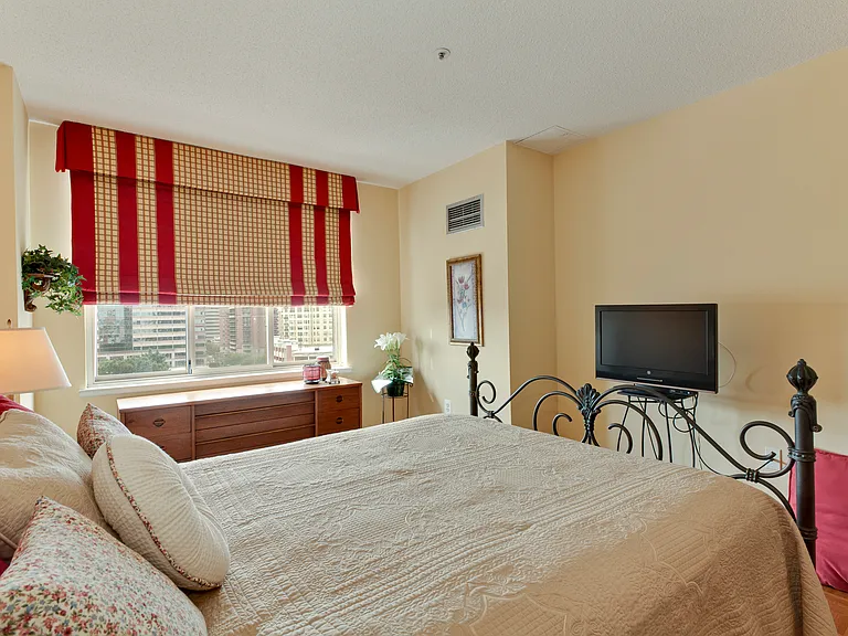 Large, bright bedroom.