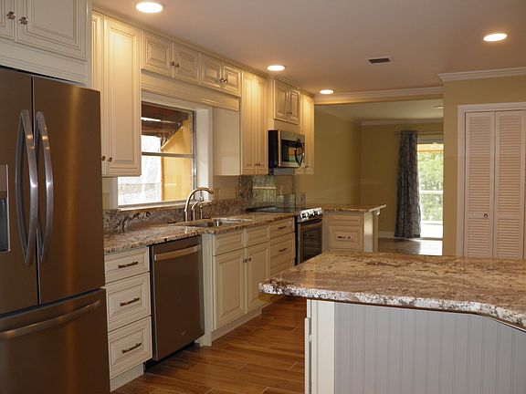 Large eat -in kitchen with 2 seating areas. Kitchen adjoins the sitting room to the deck.