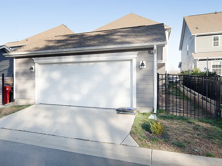 Garage/trash can storage/fenced yard/garden boxes