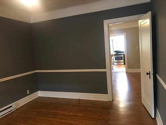 Living room looking into the bedroom and kitchen (when doors are open)
