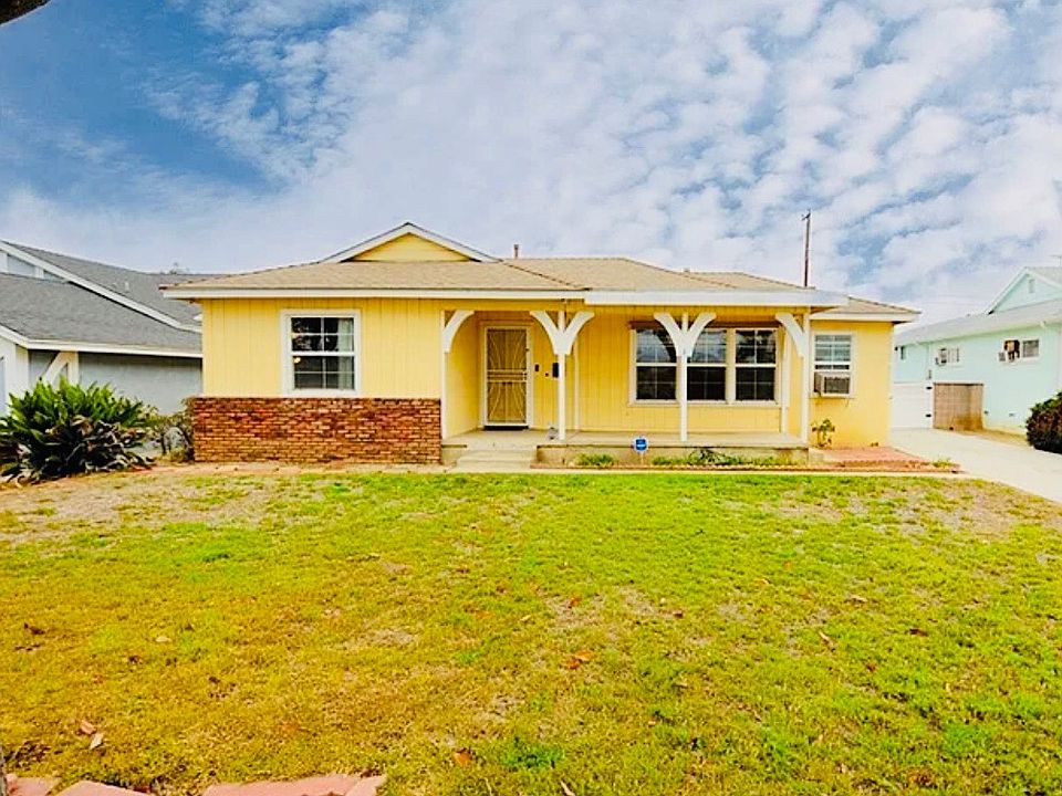 Front yard with porch. Large drive way and gated back yard. Detached 2 car garage