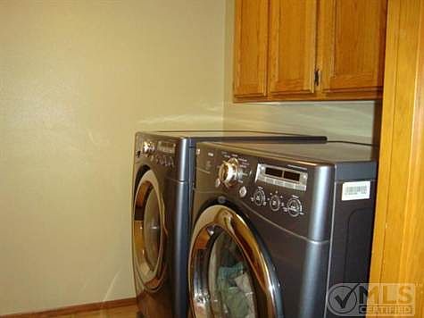 Laundry room with cabinets