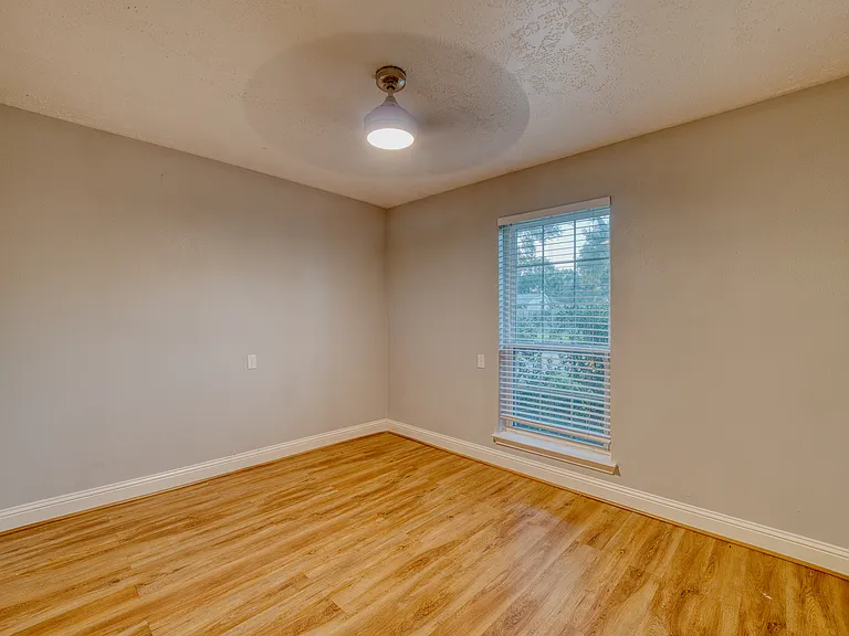 Flexible room perfect as a bedroom, home office, or study.