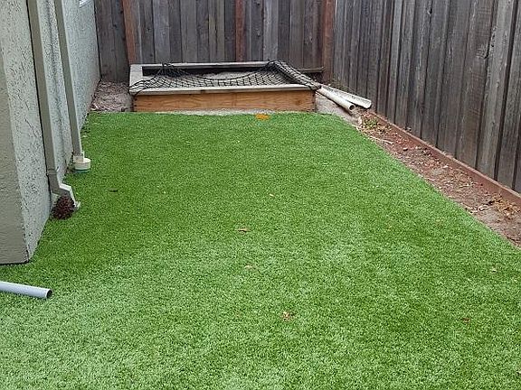 Large, private, low-maintenance backyard with sandbox