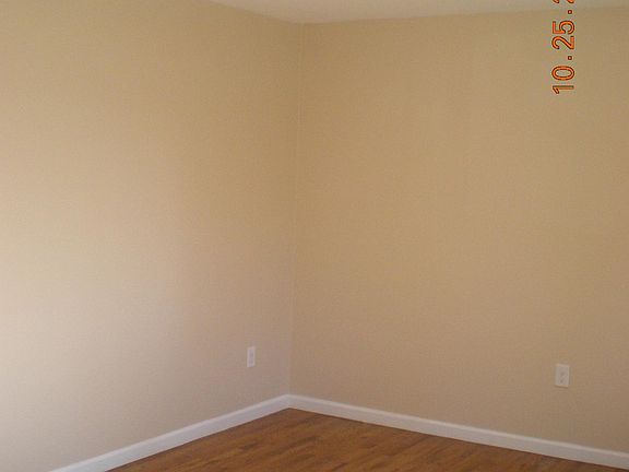 Sunny living room with wood floors