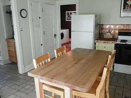 The laundry room is through the open doorway.