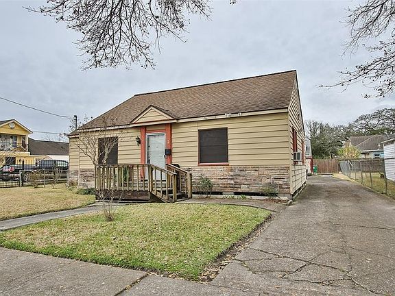 View of the driveway leading into the back of the property.