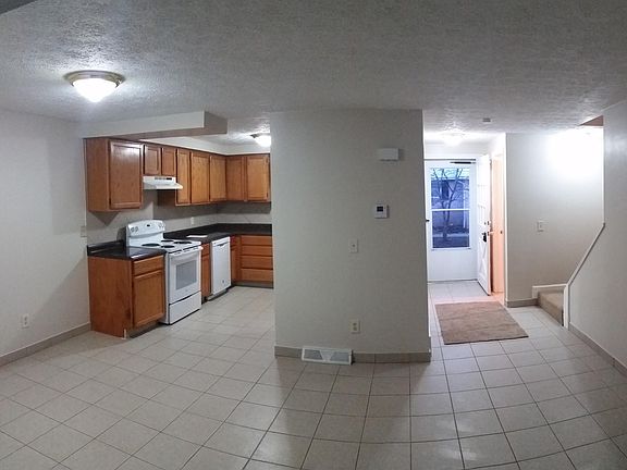 Panoramic view of kitchen and hall from living room