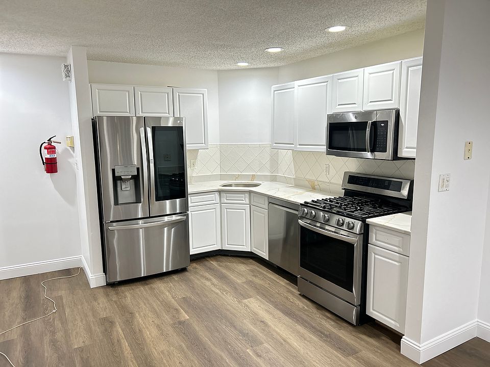Renovated Kitchen with SS appliances and Quartz Countertop