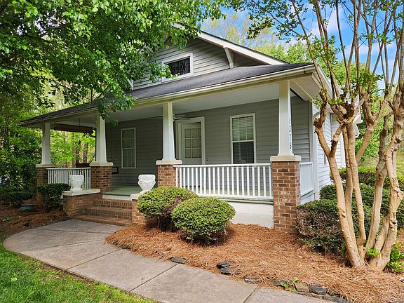 Front porch with porch swing and screens
