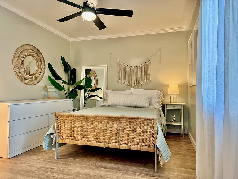 Extra cozy full/double size bed with firm mattress and Tempur-Pedic mattress topper, ceiling fan, chest of drawers, jewelry stand, large closet with plenty of hangers, and attached bathroom