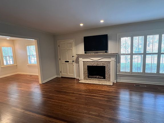 Walk in the front door to living room with adjacent dining room