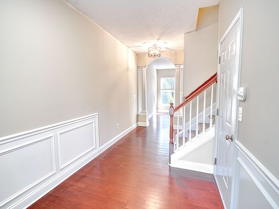 Foyer. Hardwood floors throughout main floor. Wainscoting.